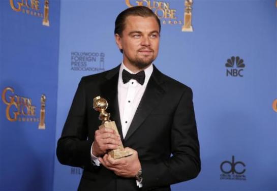 Actor Leonardo DiCaprio poses with the award for Best Actor in a Motion Picture, Musical or Comedy for his role in "The Wolf of Wall Street" at the 71st annual Golden Globe Awards in Beverly Hills