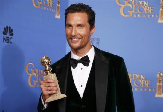Actor Matthew McConaughey poses backstage with his award for Best Actor in a Motion Picture, Drama for his role in "Dallas Buyers Club" at the 71st annual Golden Globe Awards in Beverly Hills
